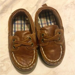 Boy dressing shoes